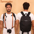 Camstrap Nomad 20L hands-free photography backpack worn on one shoulder with a DSLR clipped to the strap.