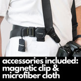 Camstrap Explorer hands-free camera harness worn over both shoulders, supporting a DSLR with a telephoto lens.