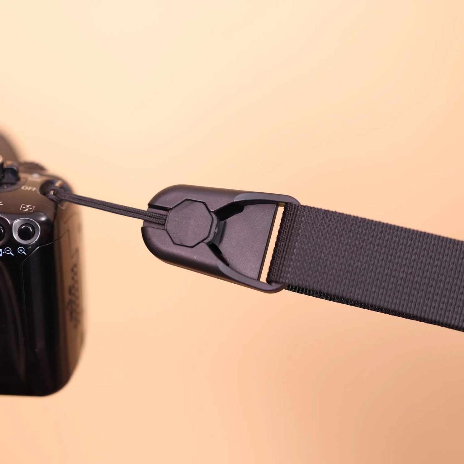 Camstrap Trek patented quick-release connector on a camera lug