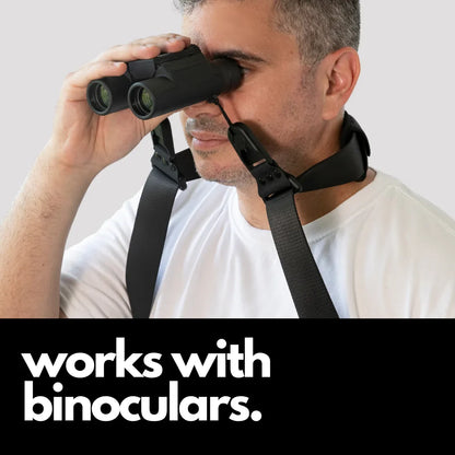 Camstrap Explorer hands-free camera harness worn over both shoulders, supporting a DSLR with a telephoto lens.
