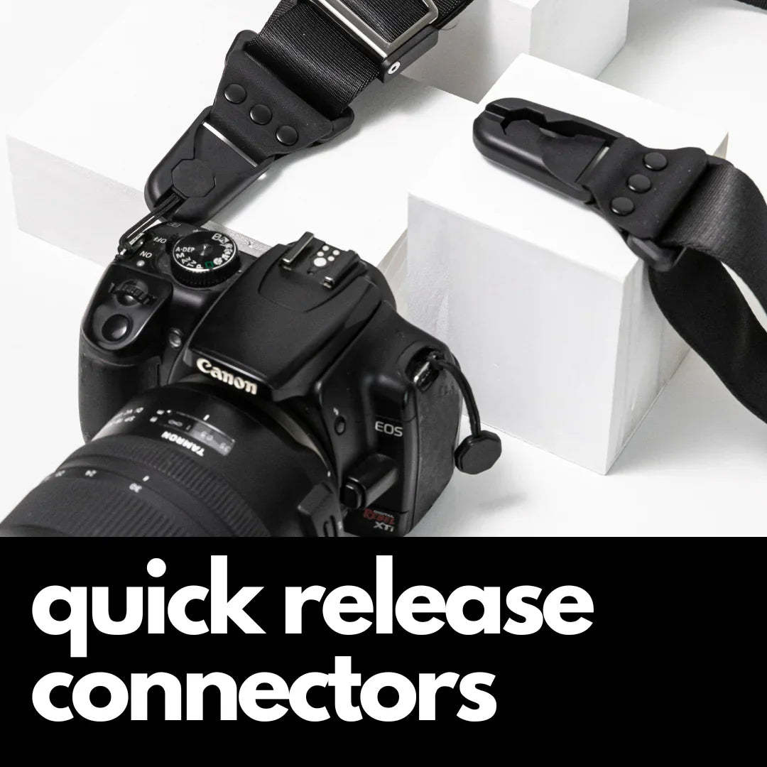 Camstrap Explorer hands-free camera harness worn over both shoulders, supporting a DSLR with a telephoto lens.