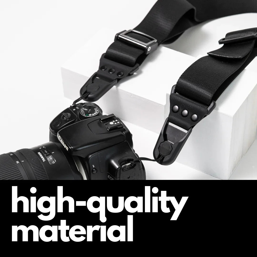 Camstrap Explorer hands-free camera harness worn over both shoulders, supporting a DSLR with a telephoto lens.