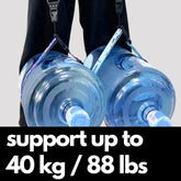 Camstrap Explorer hands-free camera harness worn over both shoulders, supporting a DSLR with a telephoto lens.