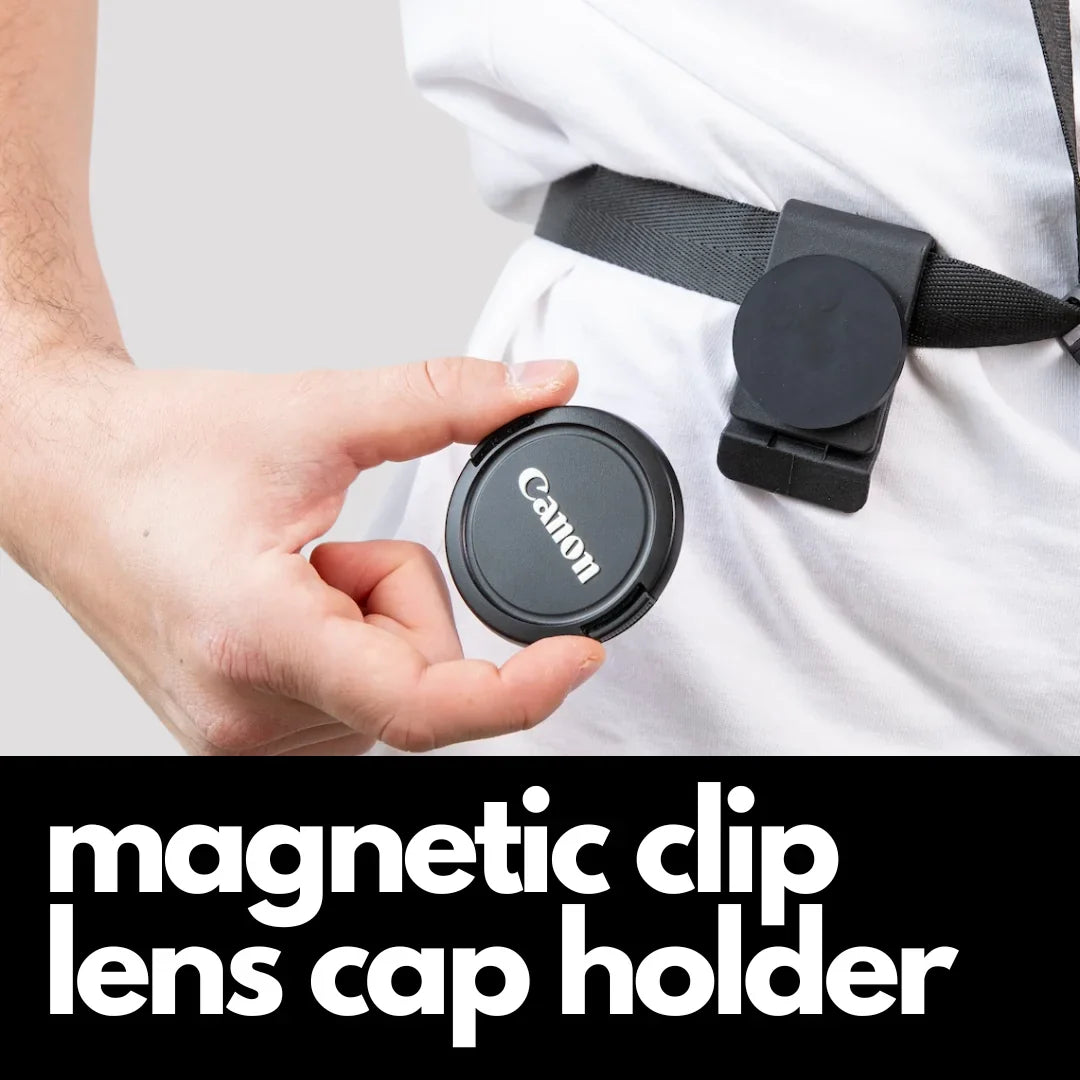 Camstrap Explorer hands-free camera harness worn over both shoulders, supporting a DSLR with a telephoto lens.