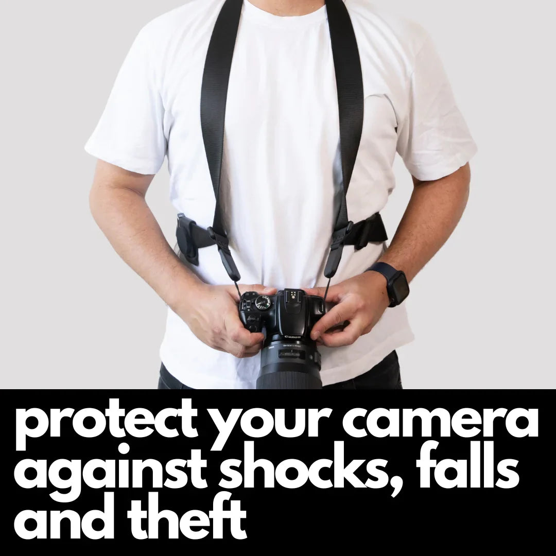 Camstrap Explorer hands-free camera harness worn over both shoulders, supporting a DSLR with a telephoto lens.