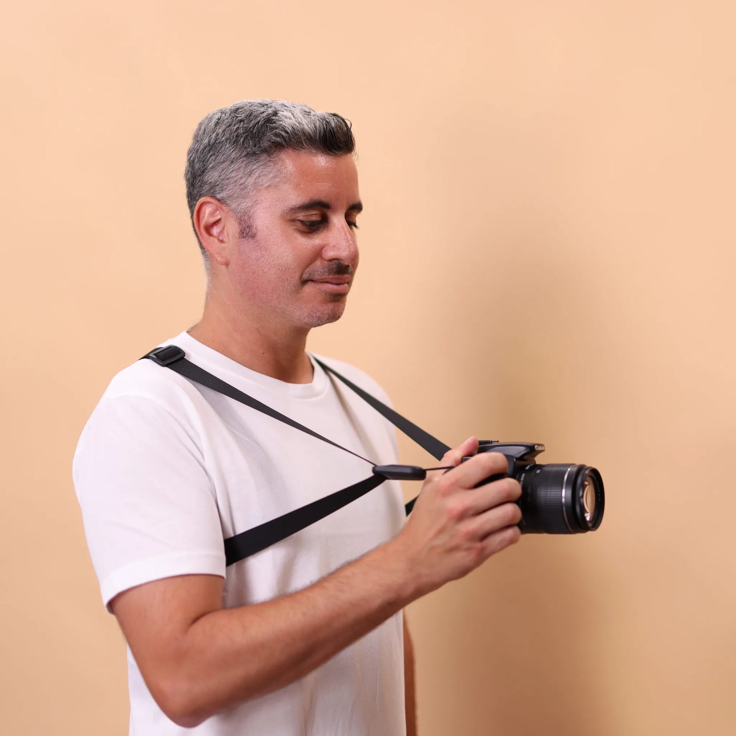 Camstrap Trek in use, both shoulder straps carrying the camera as it is operated