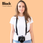 Camstrap Voyager hands-free camera strap worn across the torso, holding a DSLR close to the body.